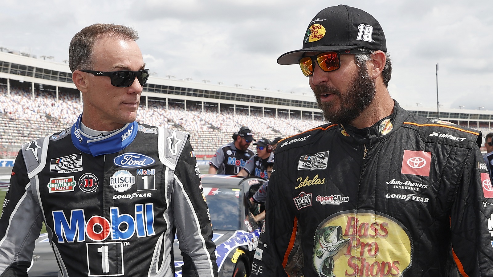 Kevin Harvick and Martin Truex Jr. walk the grid during qualifying for the NASCAR Cup Series Coca-Cola 600 at Charlotte Motor Speedway on May 29, 2021.