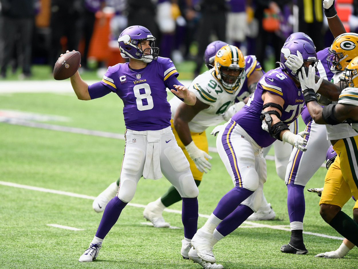 Kirk Cousins passes against the Packers.