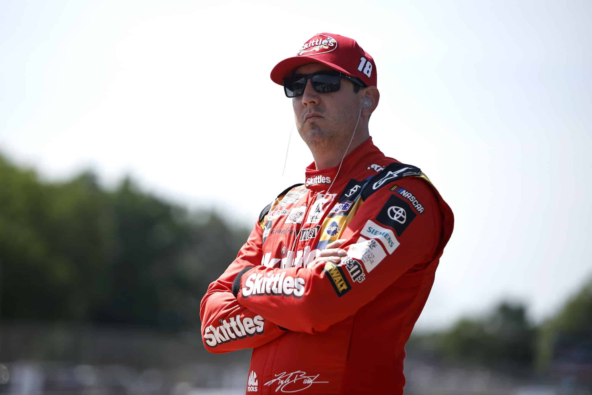 Kyle Busch looks on during practice