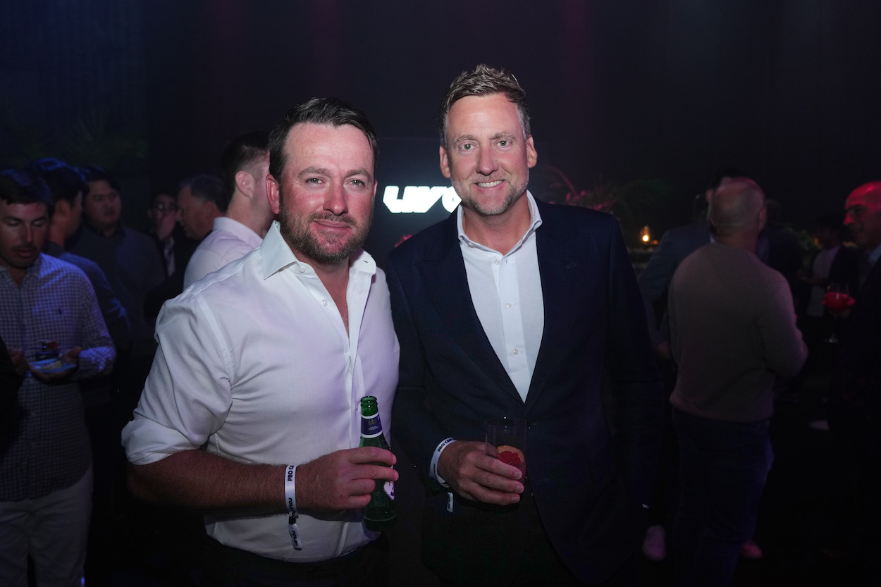 Graeme McDowell of Northern Ireland and Ian Poulter of England pose for a photograph during the LIV Golf Invitational draft. Mastercard paused its sponsorship deals with both golfers.