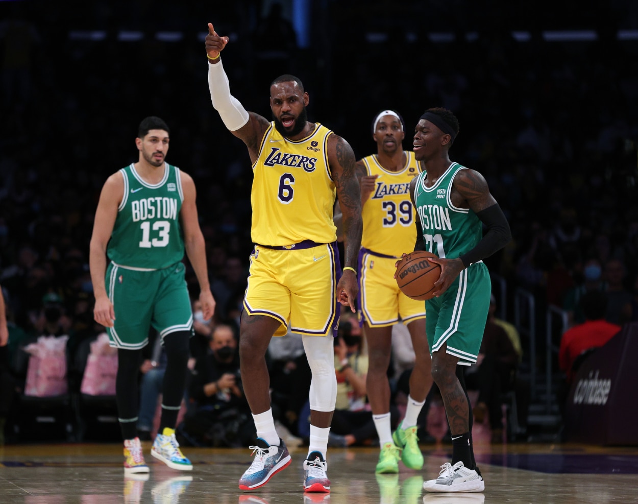 LeBron James of the Los Angeles Lakers reacts to an offensive foul on Dennis Schroder, right.