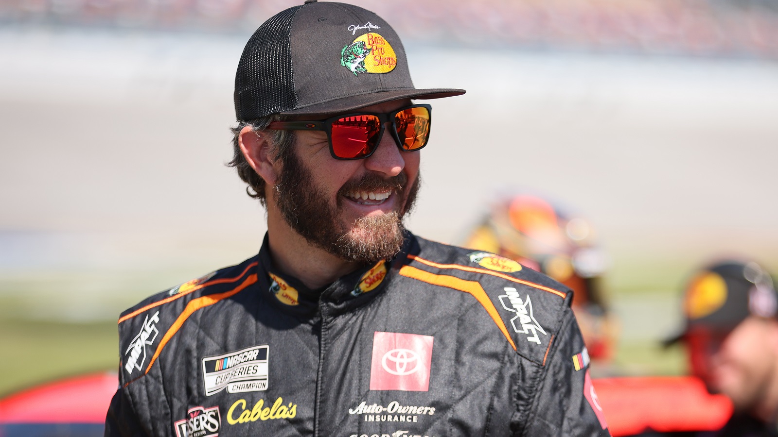 Martin Truex Jr. walks the grid during qualifying for the NASCAR Cup Series GEICO 500 at Talladega Superspeedway on April 23, 2022.