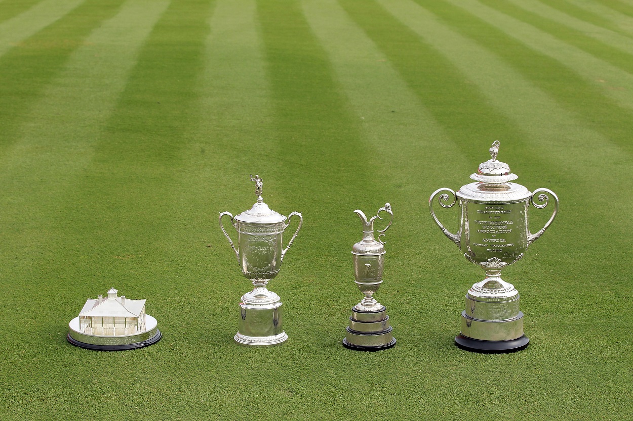 Trophies of men's golf four major championships: The Masters, U.S. Open, The Open Championship, and PGA Championship