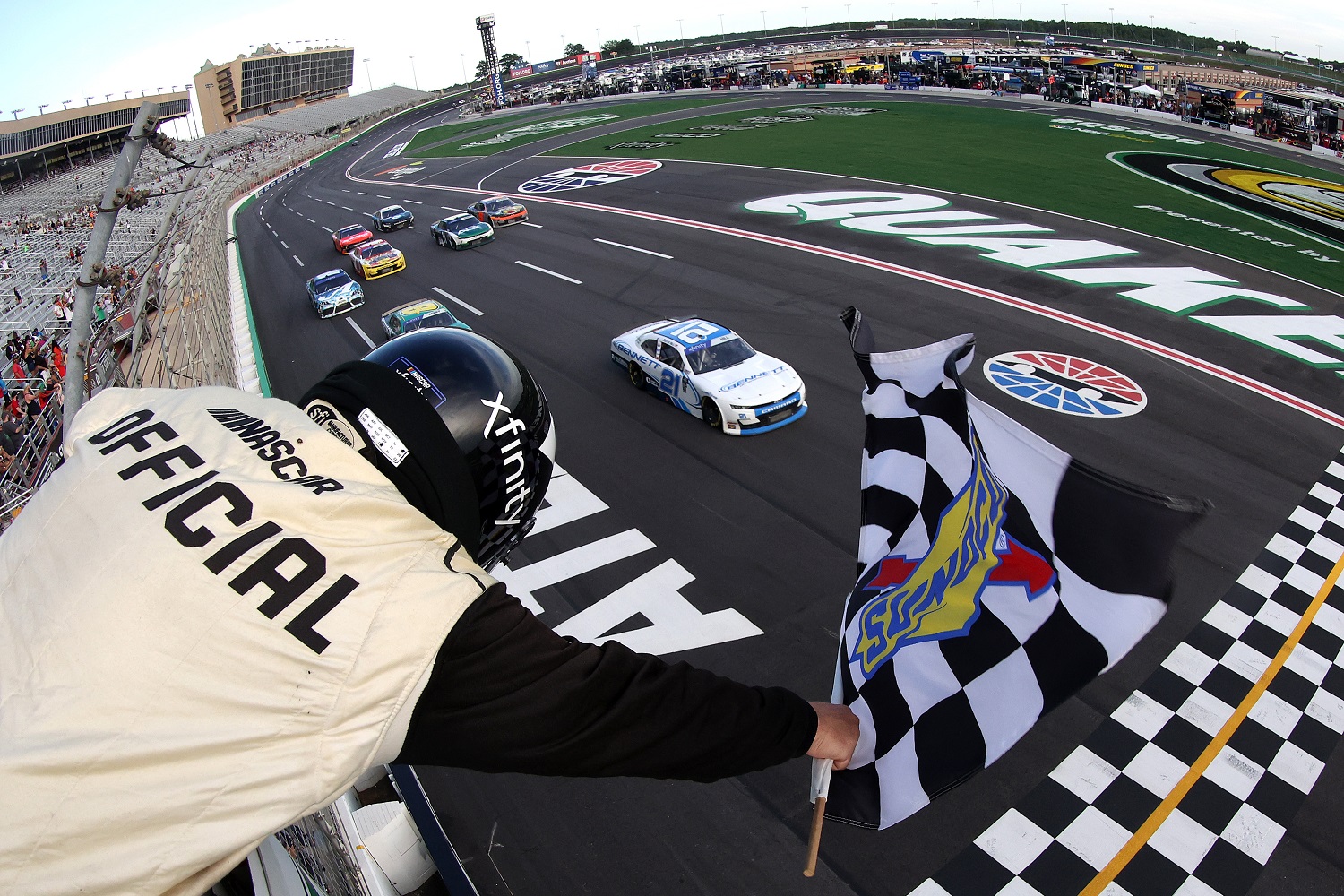 Austin Hill takes the checkered flag to win the NASCAR Xfinity Series Alsco Uniforms 250 at Atlanta Motor Speedway on July 9, 2022 in Hampton, Georgia.