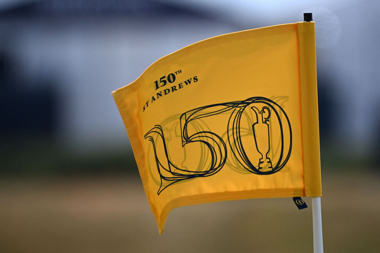 An Open Championship flag flutters in the wind.