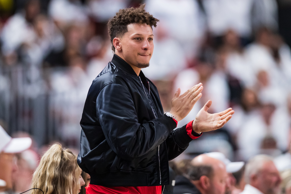 Quarterback Patrick Mahomes of the Kansas City Chiefs claps during a college basketball game between Texas Tech and Baylor