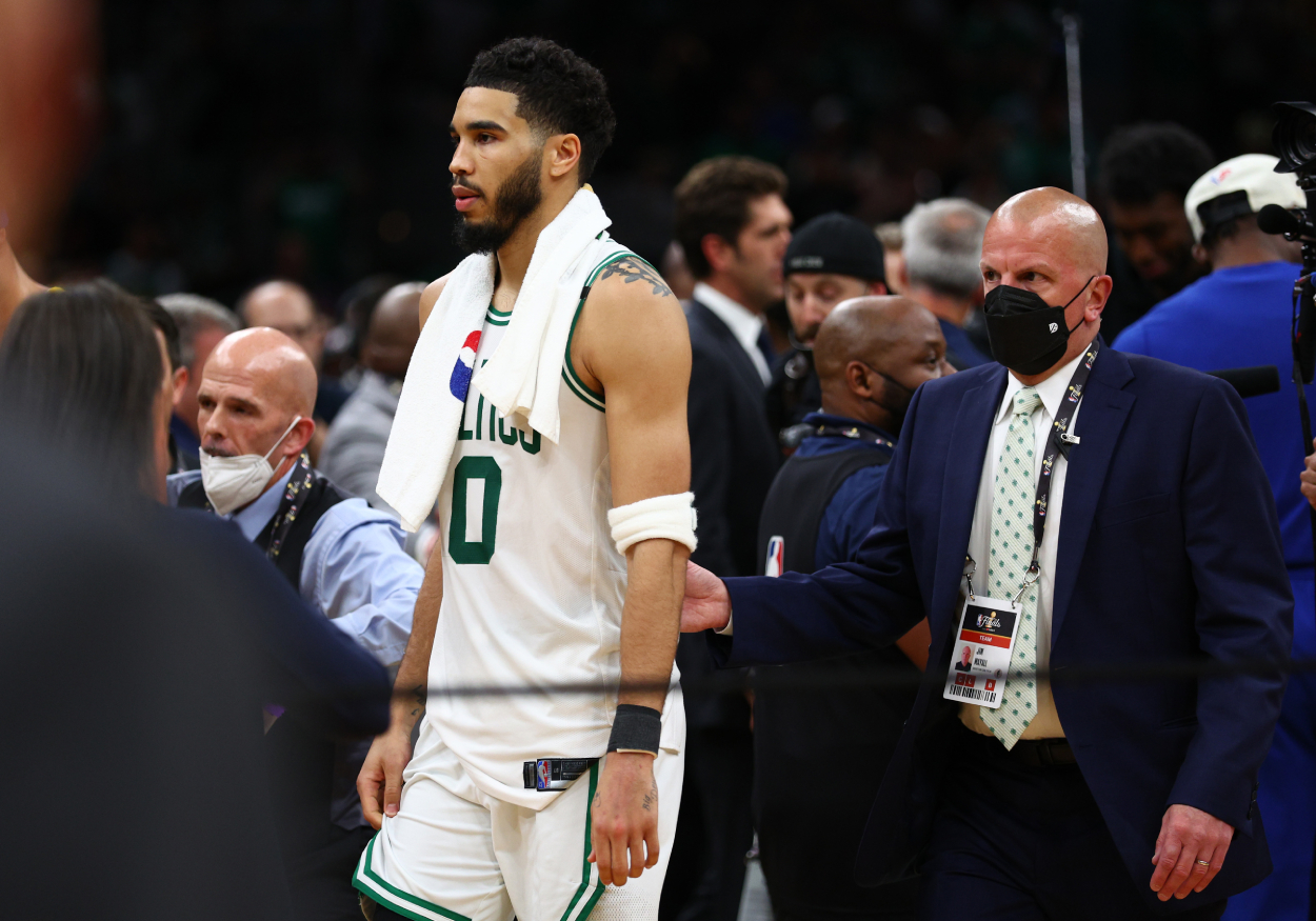 Jayson Tatum of the Boston Celtics walks off the floor after losing to the Golden State Warriors.