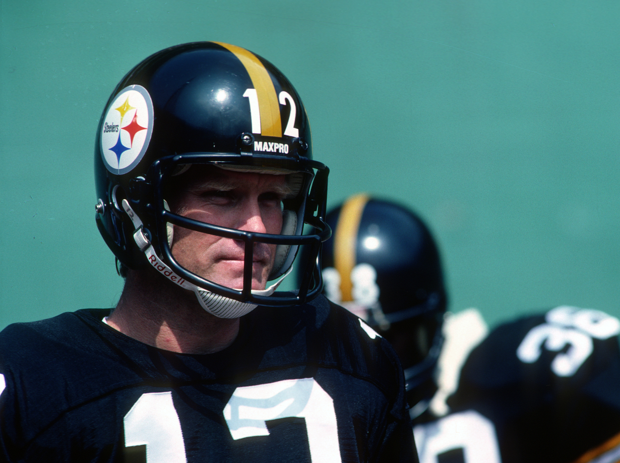 Quarterback Terry Bradshaw of the Pittsburgh Steelers looks on from the sideline.