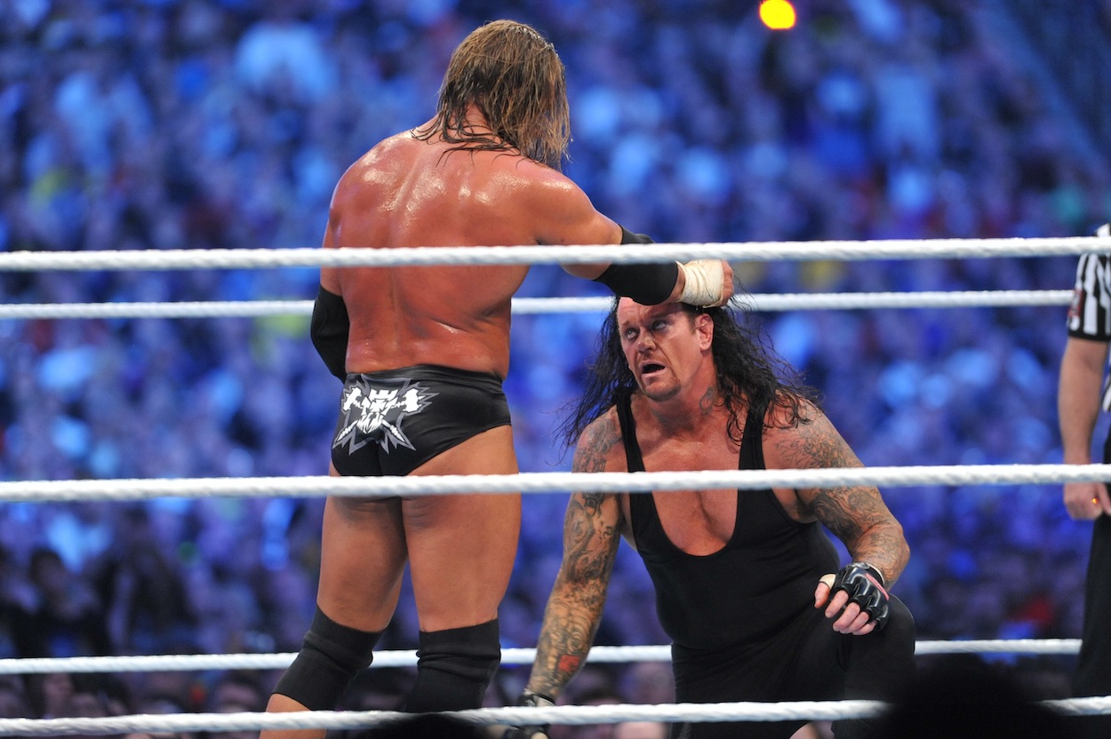 Triple H and The Undertaker battle during their WWE match at 'WrestleMania 27'.