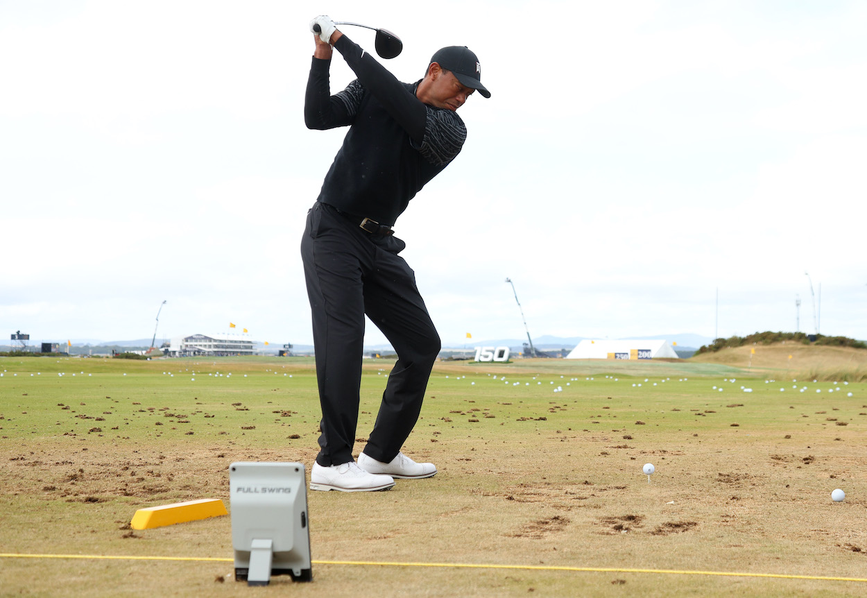 Tiger Woods warms up before the Open Championship.