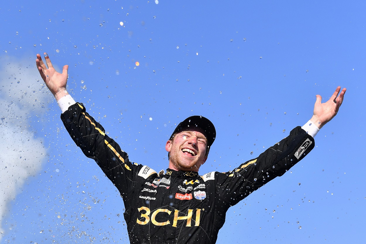 Tyler Reddick celebrates after winning the 2022 NASCAR Cup Series Kwik Trip 250