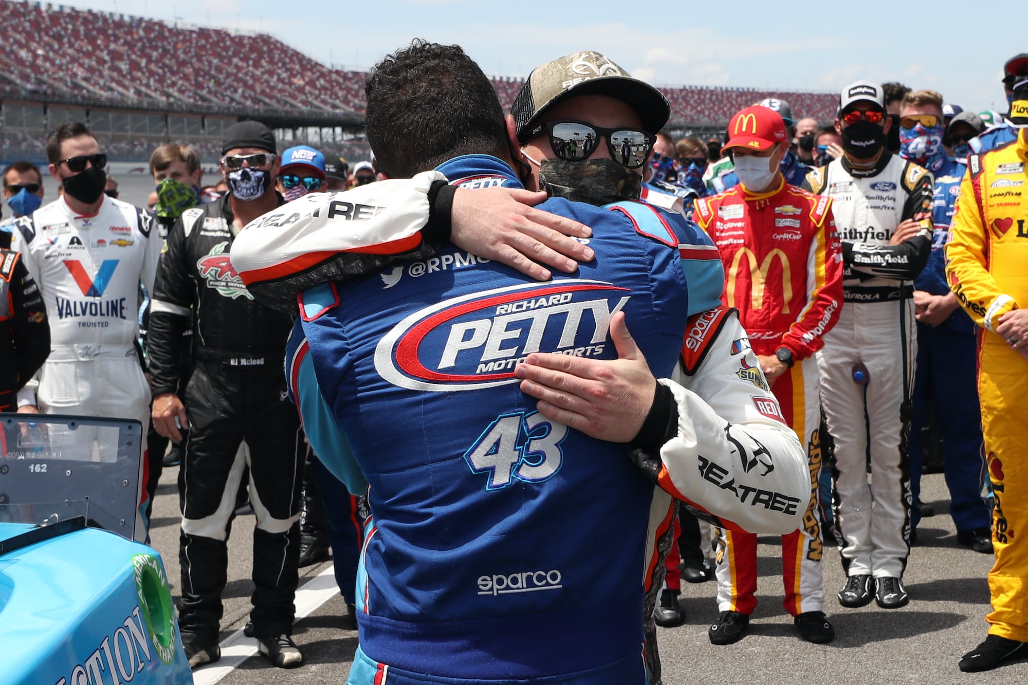 Tyler Reddick and Bubba Wallace hug