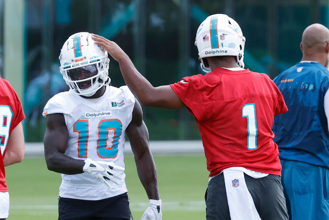 Tyreek Hill (L) and Tua Tagovailoa (R) during a Miami Dolphins workout.