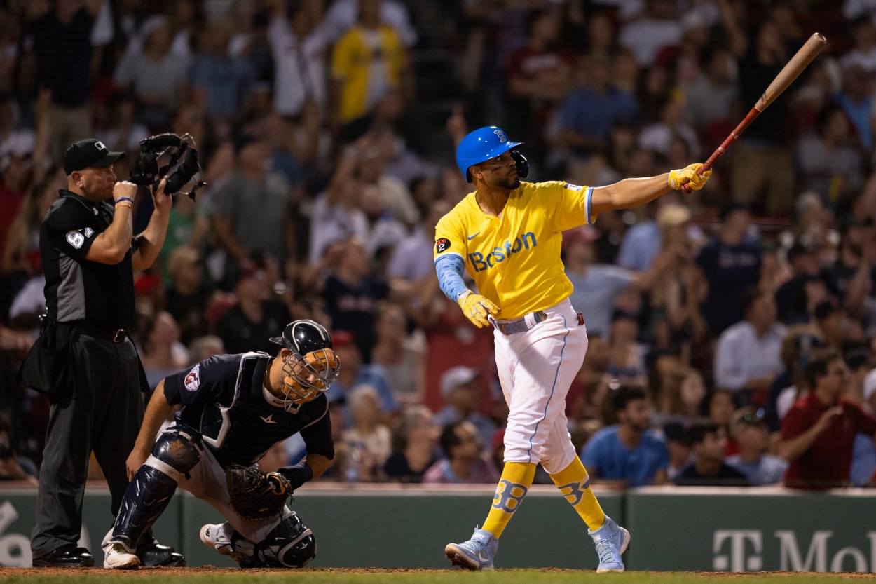 Xander Bogaerts of the Boston Red Sox reacts after hitting a go-ahead three run home run.