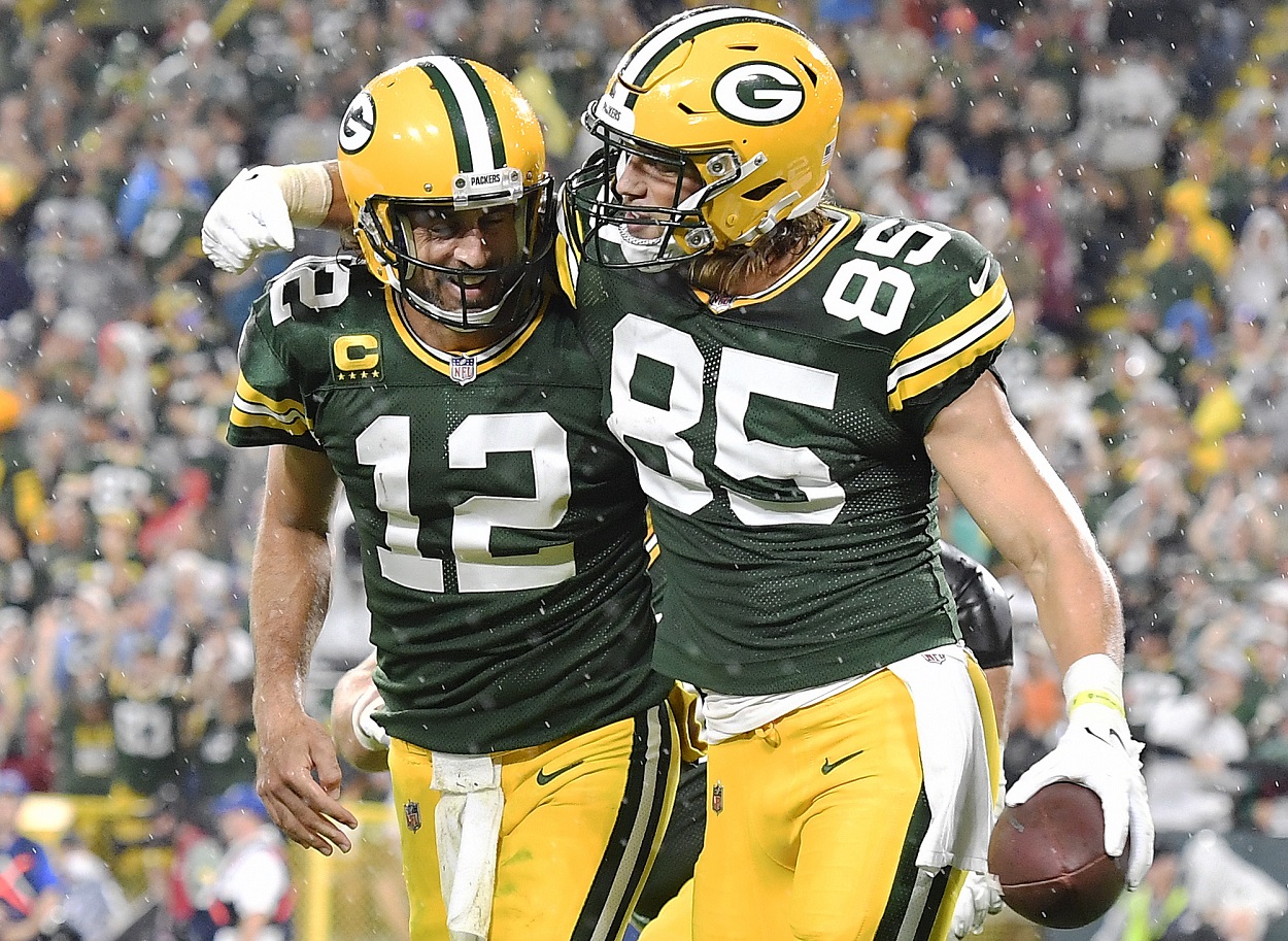 Aaron Rodgers and Robert Tonyan celebrate a touchdown during a Packers-Lions matchup in September 2021