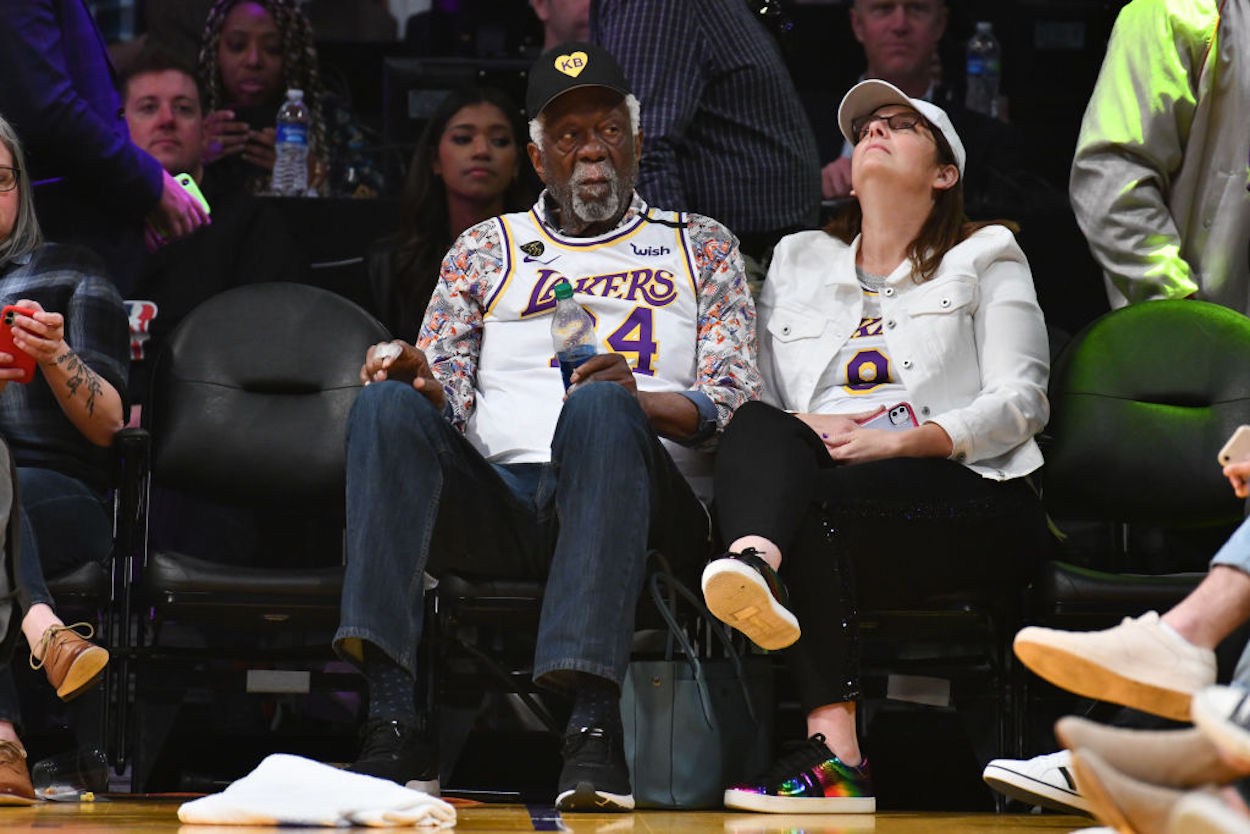 Bill Russell watches a Lakers game wearing a Kobe Bryant jersey