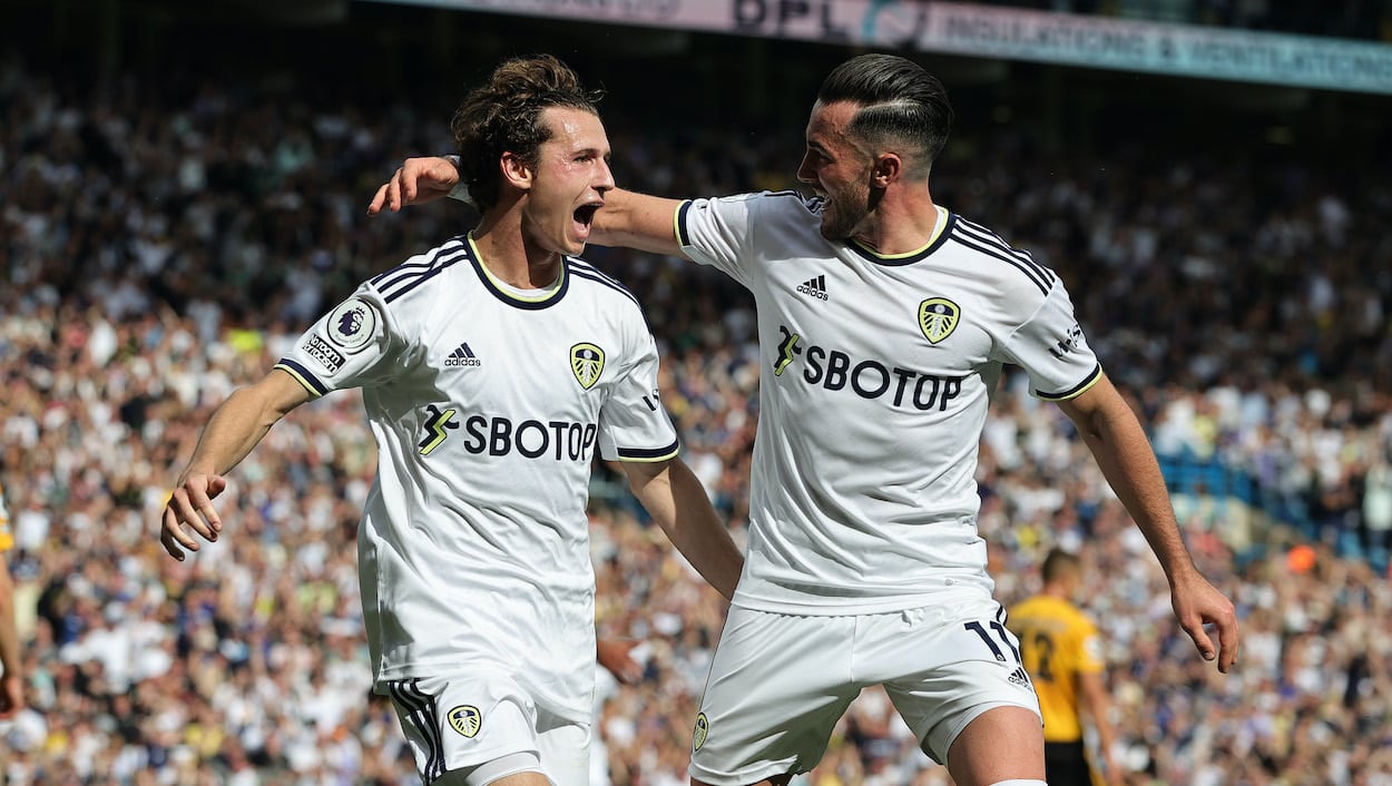 Brenden Aaronson (L) of Leeds United and the USMNT celebrates with teammate Jack Harrison.