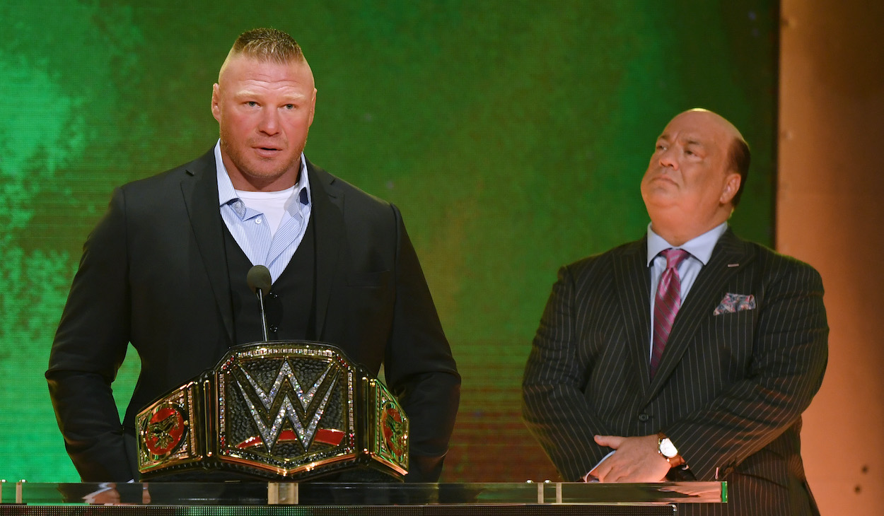 WWE champion Brock Lesnar (L) speaks during a WWE news conference as his advocate Paul Heyman looks on at T-Mobile Arena on October 11, 2019 in Las Vegas, Nevada.