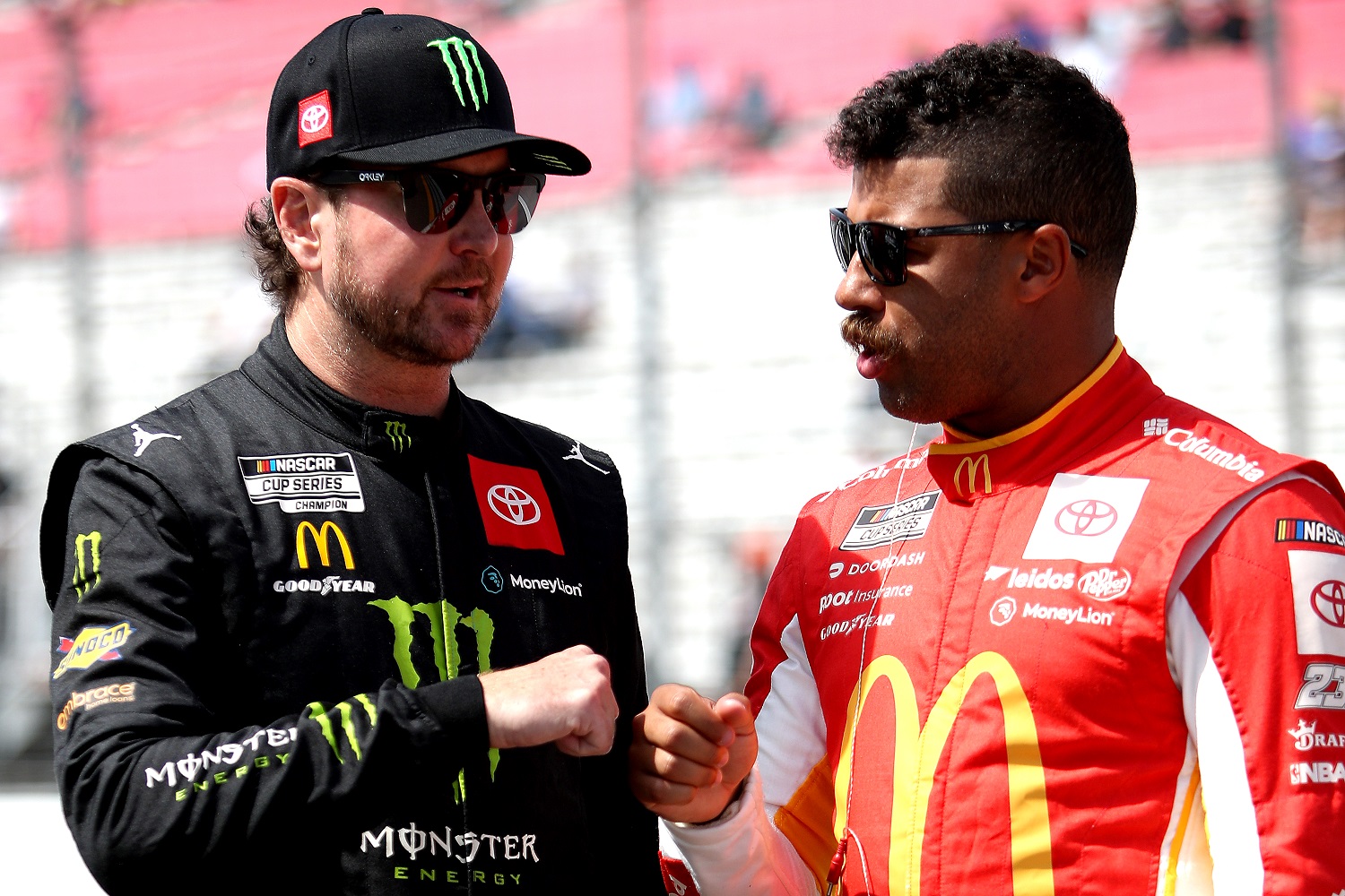 Kurt Busch and Bubba Wallace fist bump on the grid during qualifying for the NASCAR Cup Series Enjoy Illinois 300 at WWT Raceway on June 4, 2022 in Madison, Illinois. | Sean Gardner/Getty Images