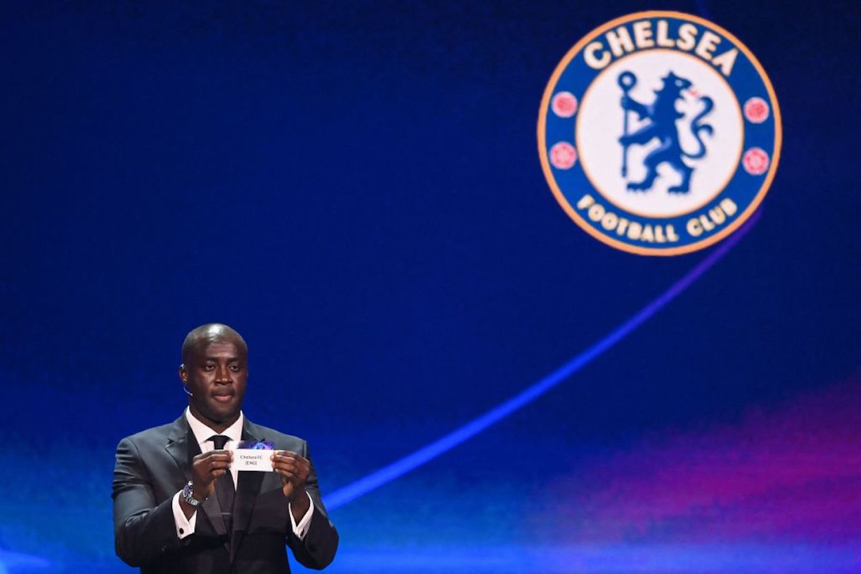 Yaya Toure holds up Chelsea's slip of paper at the 2022 Champions League draw.