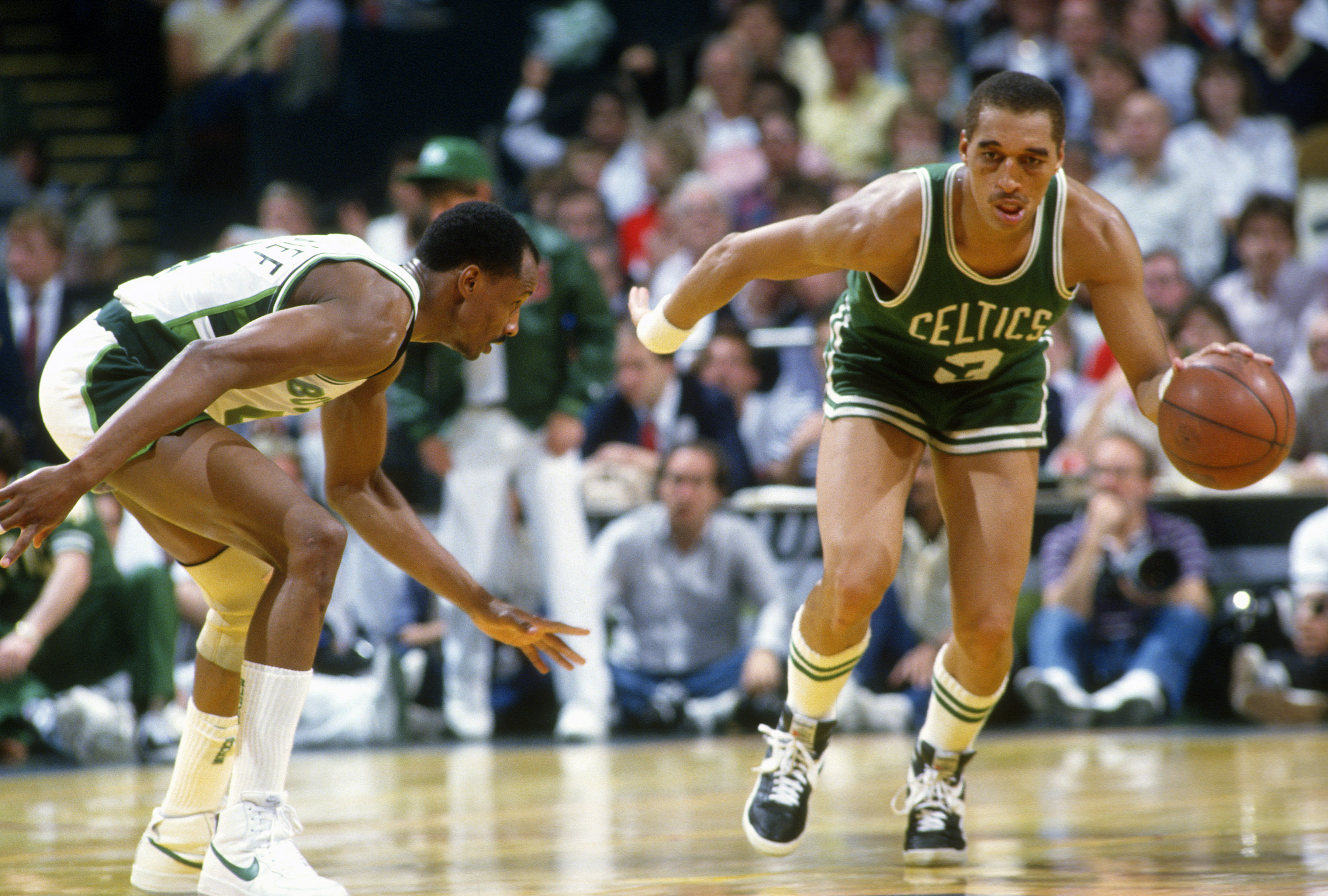 Dennis Johnson of the Boston Celtics looks to put a move on Sidney Moncrief of the Milwaukee Bucks.