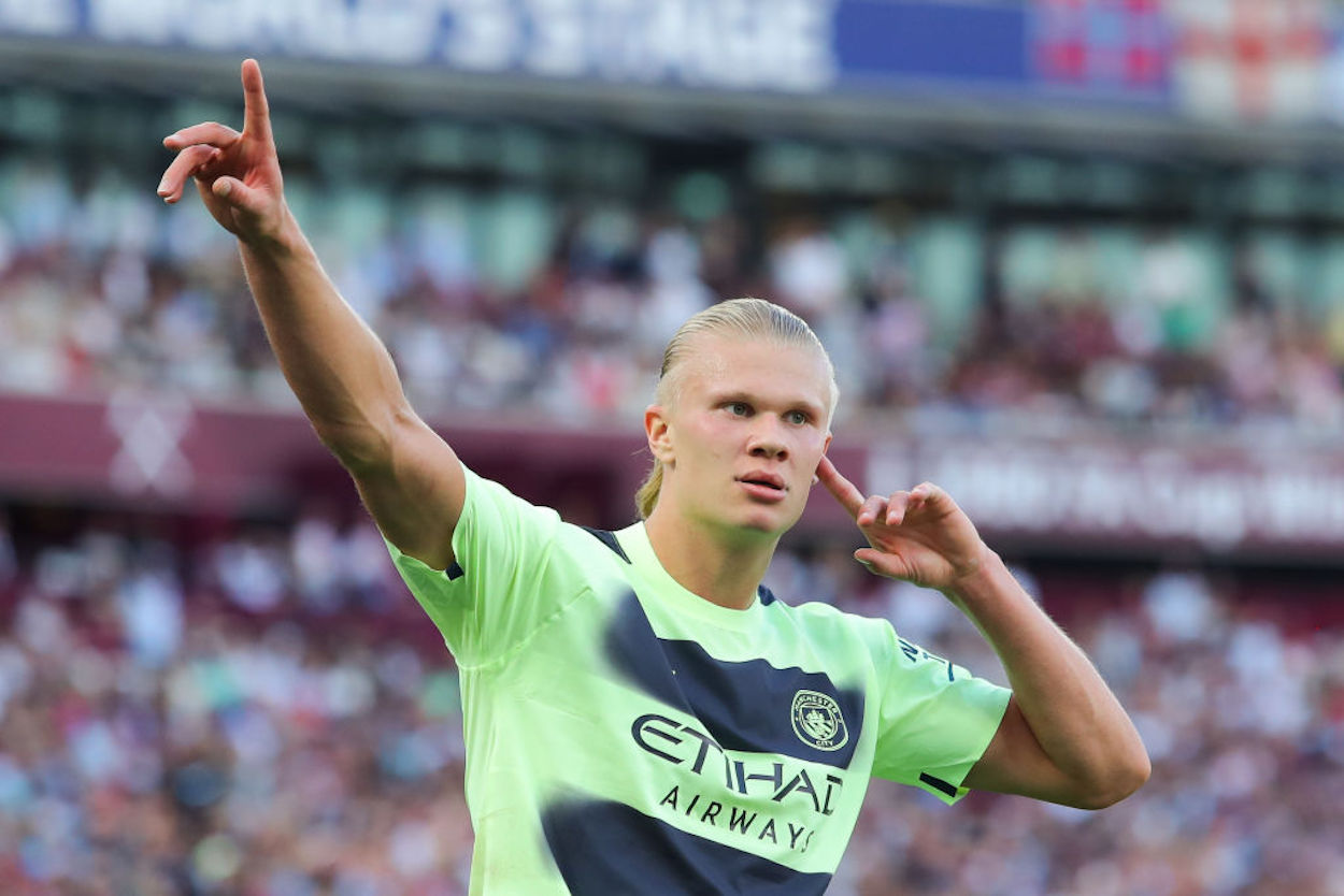 Erling Haaland gestures after scoring for Manchester City.