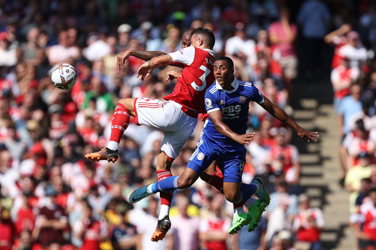 Granit Xhaka of Arsenal and Youri Tielemans of Leicester jump for a loose ball.