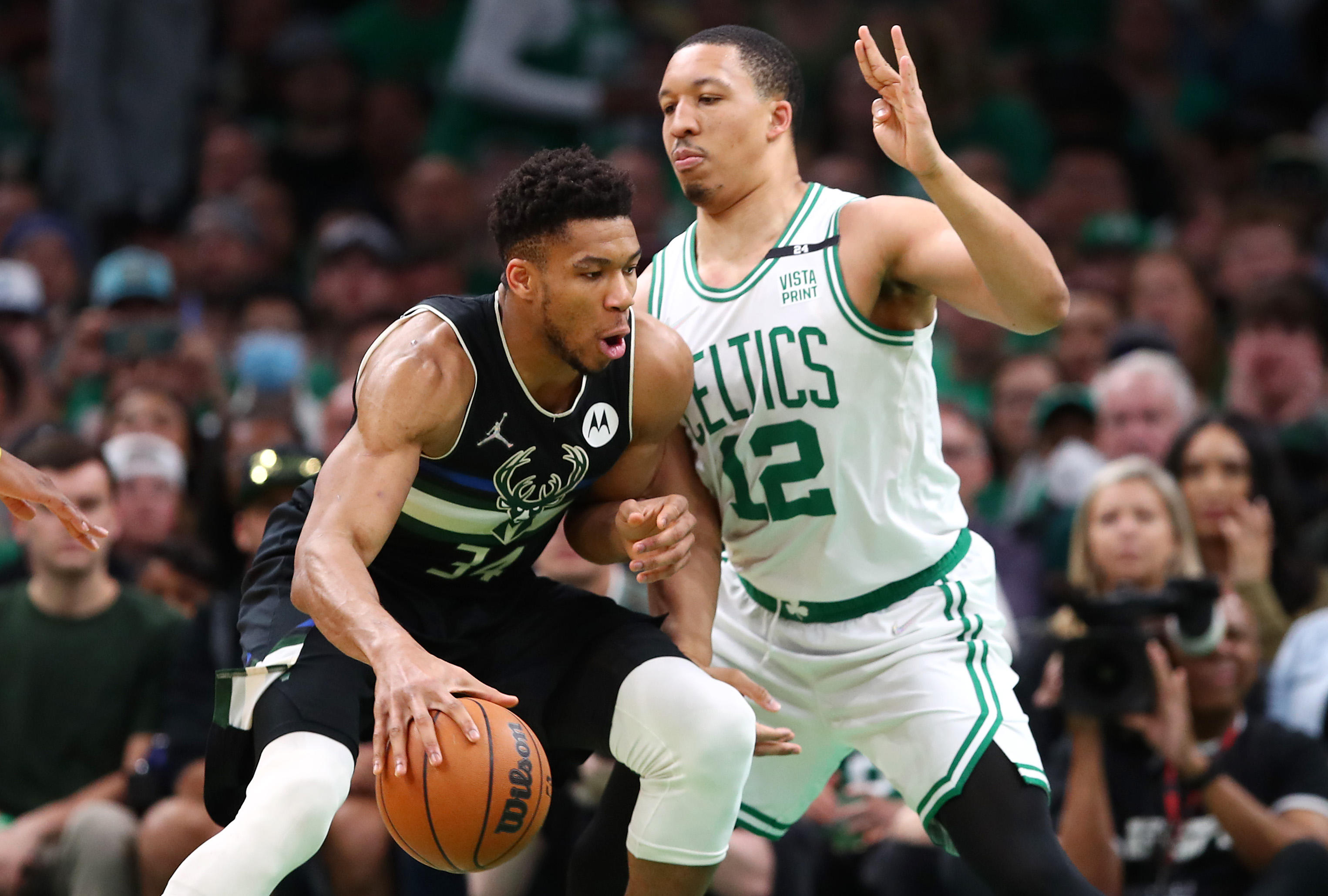 Grant Williams of the Boston Celtics defends Giannis Antetokounmpo of the Milwaukee Bucks.