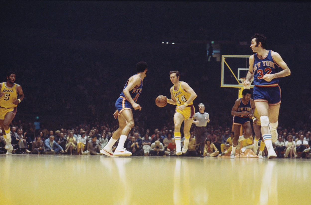 Jerry West dribbles the ball up the court during his time with the LA Lakers.