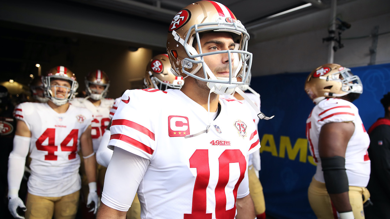 Jimmy Garoppolo of the San Francisco 49ers prepares to take the field with teammates before the NFC Championship Game in 2022.