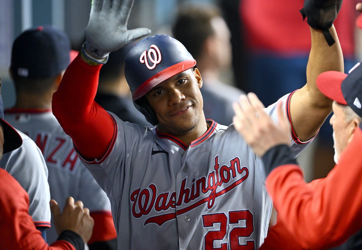 Juan Soto celebrates after scoring a run.