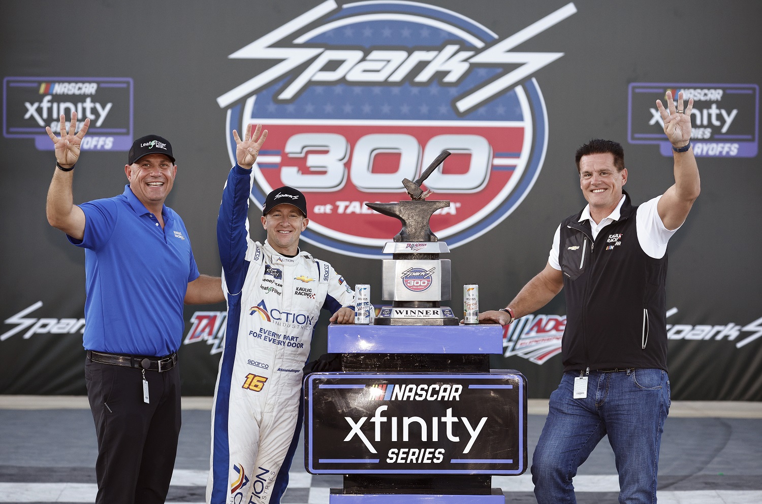 Owner Matt Kaulig, driver AJ Allmendinger, and Kaulig Racing president Chris Rice celebrate in Victory Lane after the NASCAR Xfinity Series Sparks 300 at Talladega Superspeedway on Oct. 1, 2022. | Sean Gardner/Getty Images