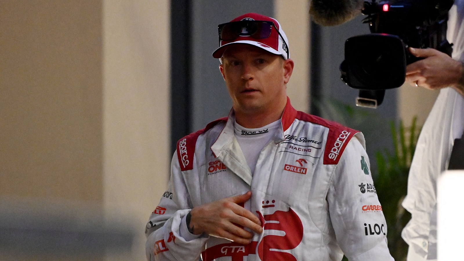 Finnish driver Kimi Raikkonen walks back in his team's hospitality area after he retired from the race at the Yas Marina Circuit during the Abu Dhabi Formula 1 Grand Prix on Dec. 12, 2021.