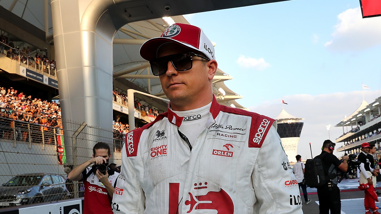 Kimi Raikkonen walks on the grid prior to the Formula 1 Grand Prix of Abu Dhabi at Yas Marina Circuit on Dec. 12, 2021. | Kamran Jebreili - Pool/Getty Images