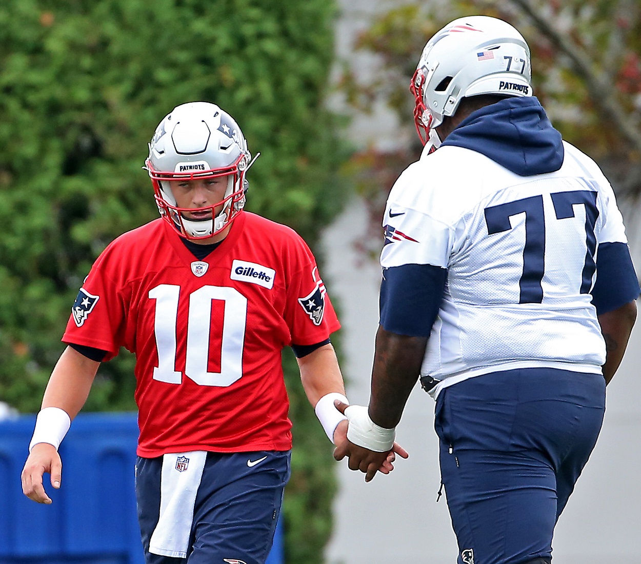 Mac Jones and Trent Brown during a Patriots practice in August 2021