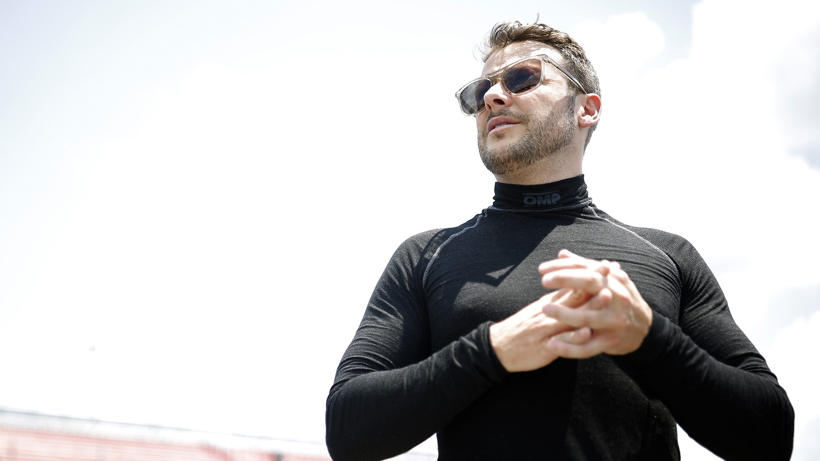 Marco Andretti stands on the grid during practice for the Camping World Superstar Racing Experience event at South Boston Speedway on June 25, 2022 in South Boston, Virginia.