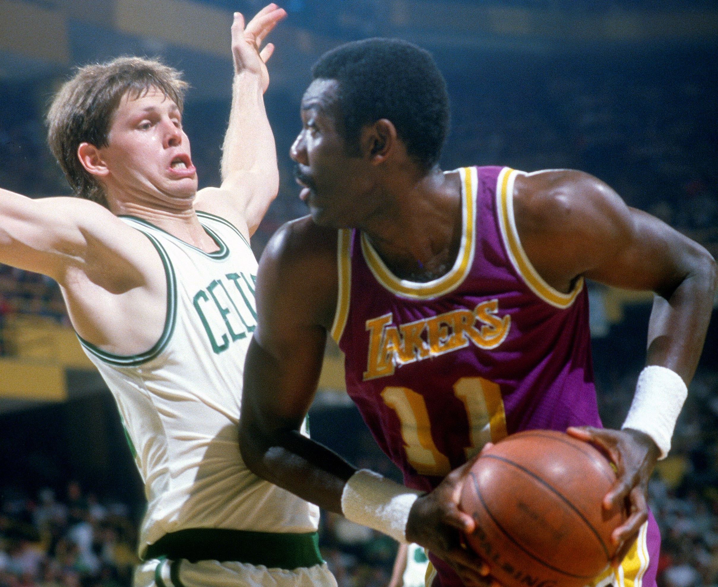 Danny Ainge of the Boston Celtics guards Bob McAdoo of the Los Angeles Lakers.