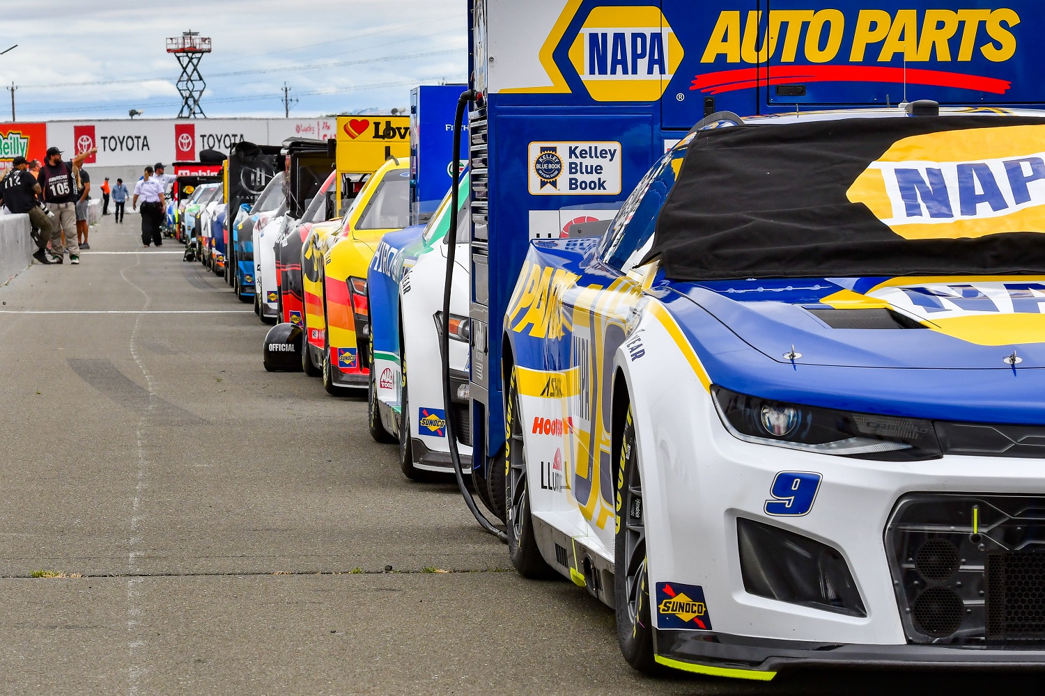 Cars lined up on pit road getting charged before the NASCAR Cup Series Toyota/Save Mart 350 race on June 12, 2022, at Sonoma Raceway.