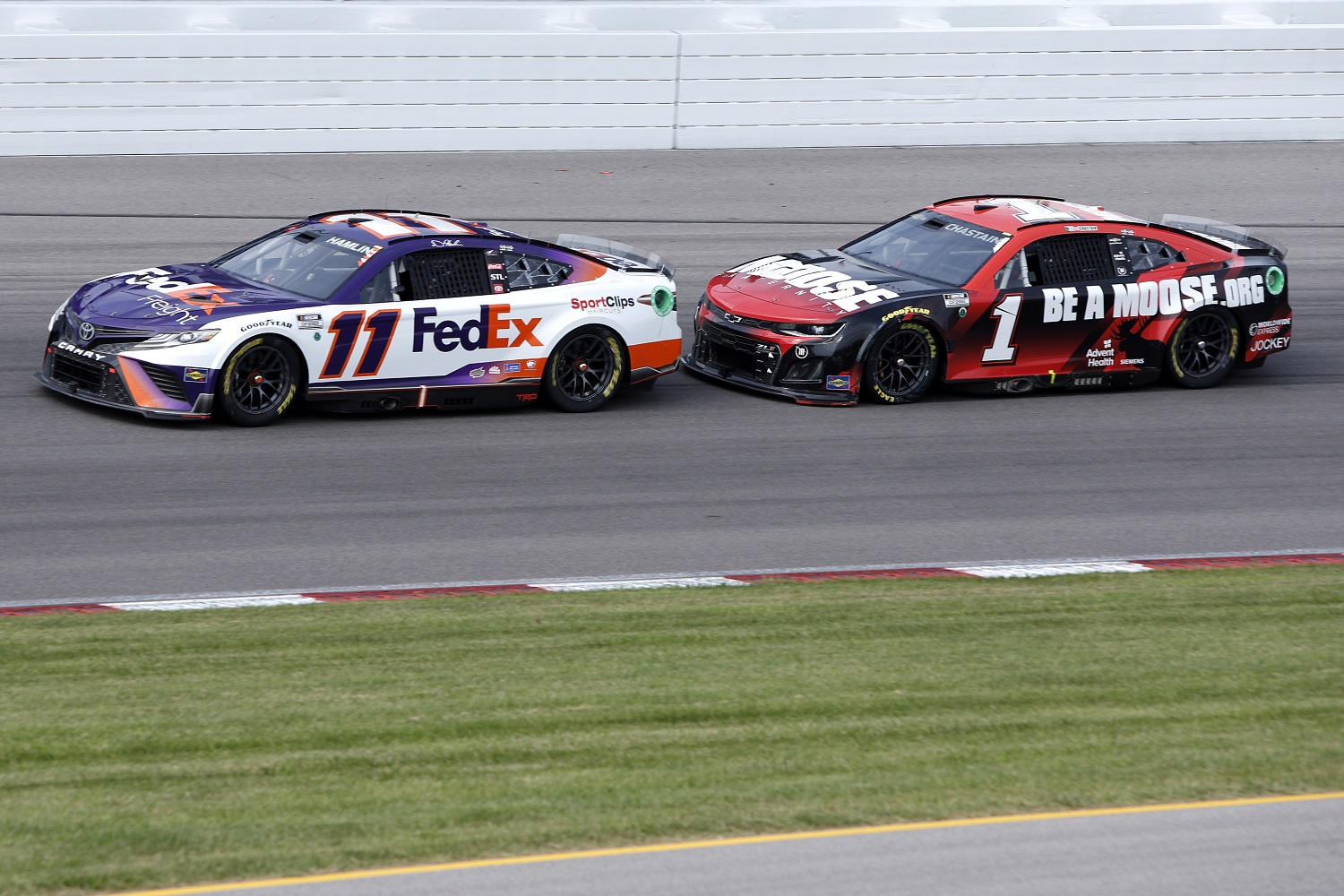 Denny Hamlin and Ross Chastain race during the NASCAR Cup Series Enjoy Illinois 300 at WWT Raceway on June 5, 2022 in Madison, Illinois.
