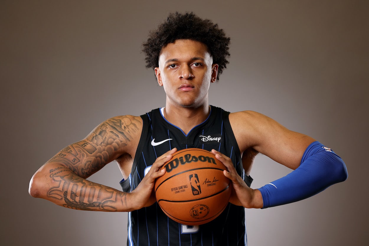 Paolo Banchero poses with a basketball.