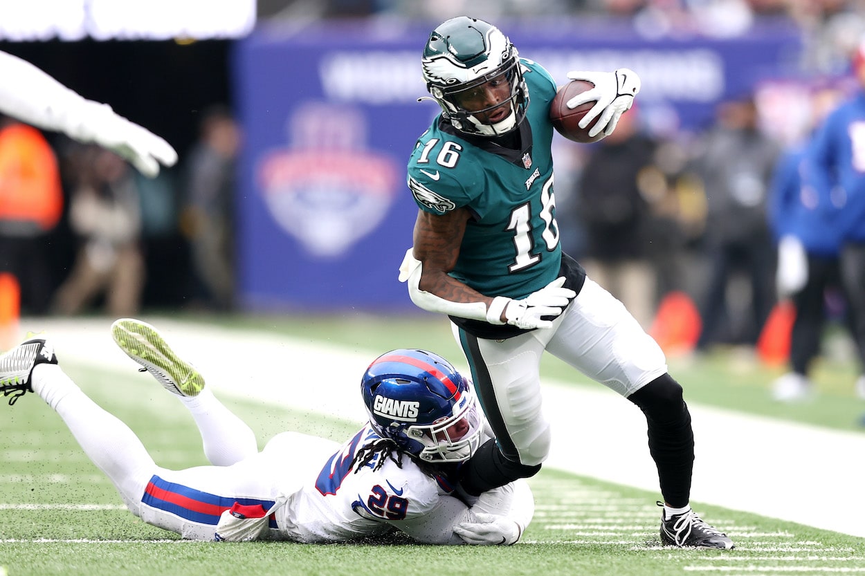 Quez Watkins runs with the ball against the Giants