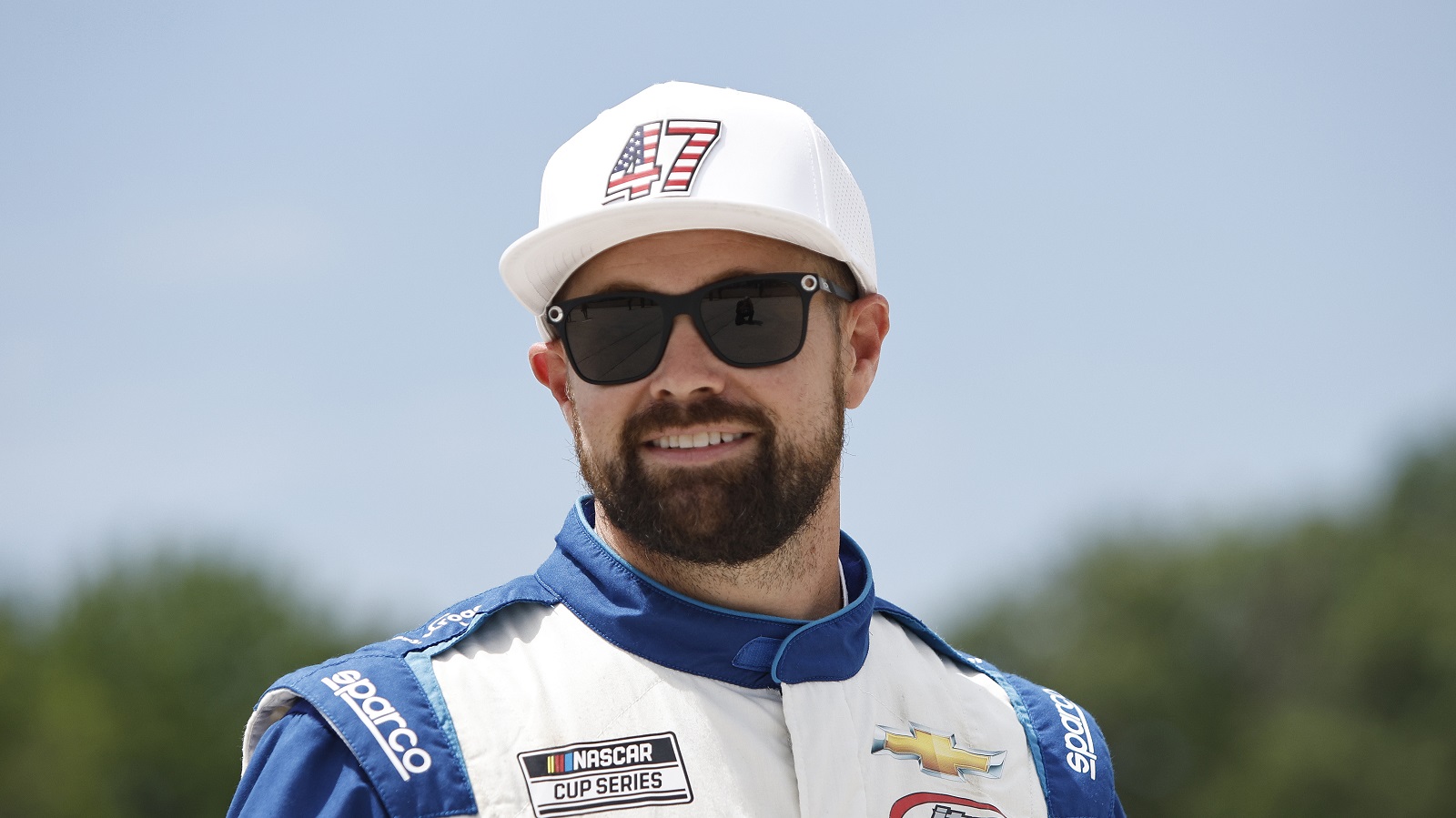 Ricky Stenhouse Jr. walks the grid prior to the NASCAR Cup Series Kwik Trip 250 at Road America on July 3, 2022 in Elkhart Lake, Wisconsin.