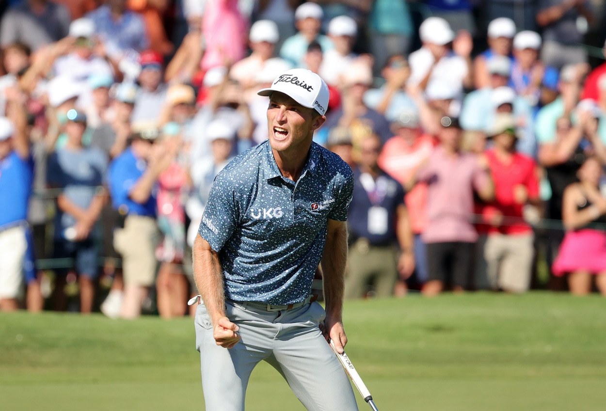 Will Zalatoris celebrates after making a putt on the 18th green.