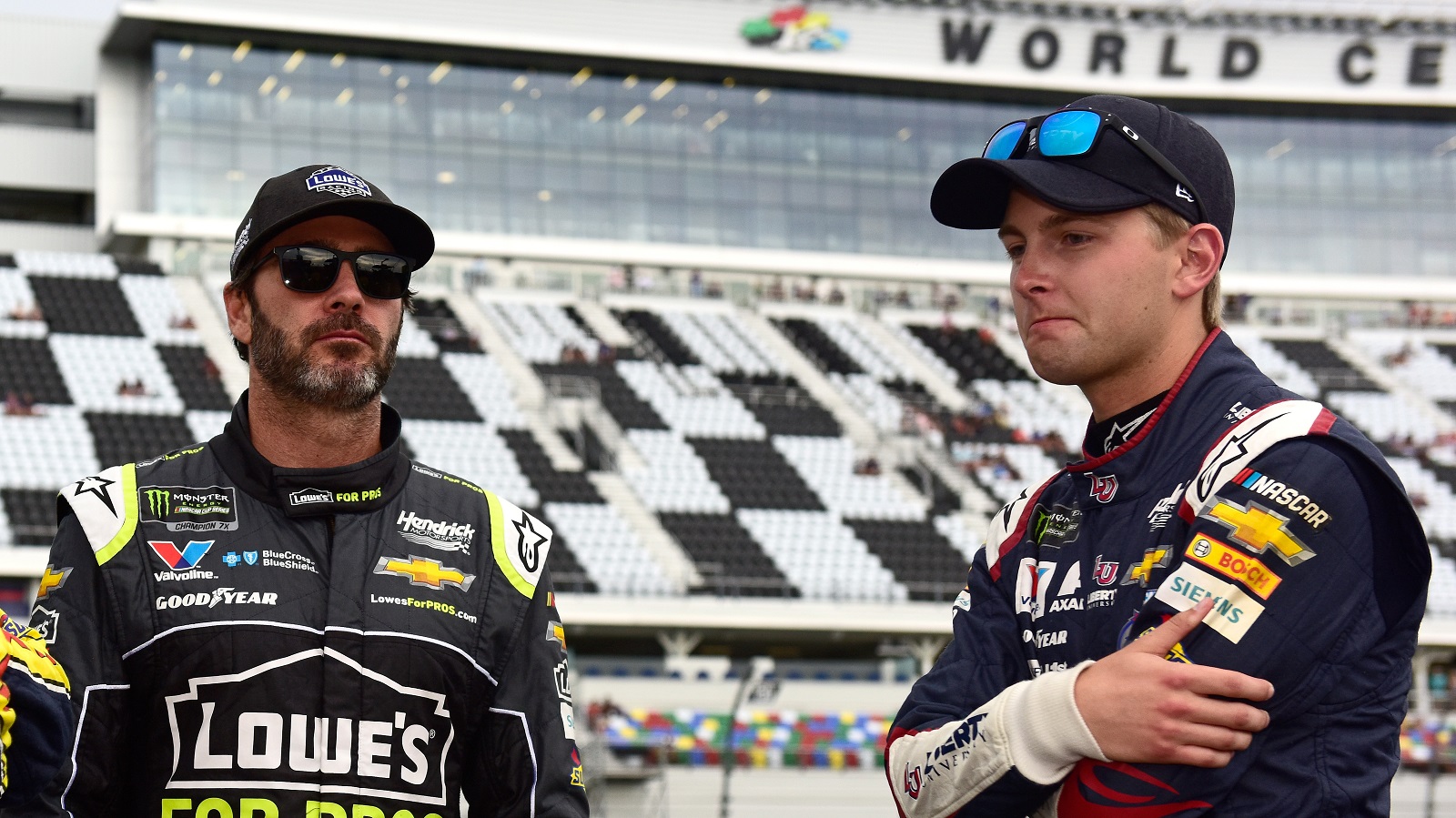Jimmie Johnson and William Byron talk during qualifying for the Monster Energy NASCAR Cup Series Coke Zero Sugar 400 at Daytona International Speedway on July 6, 2018.