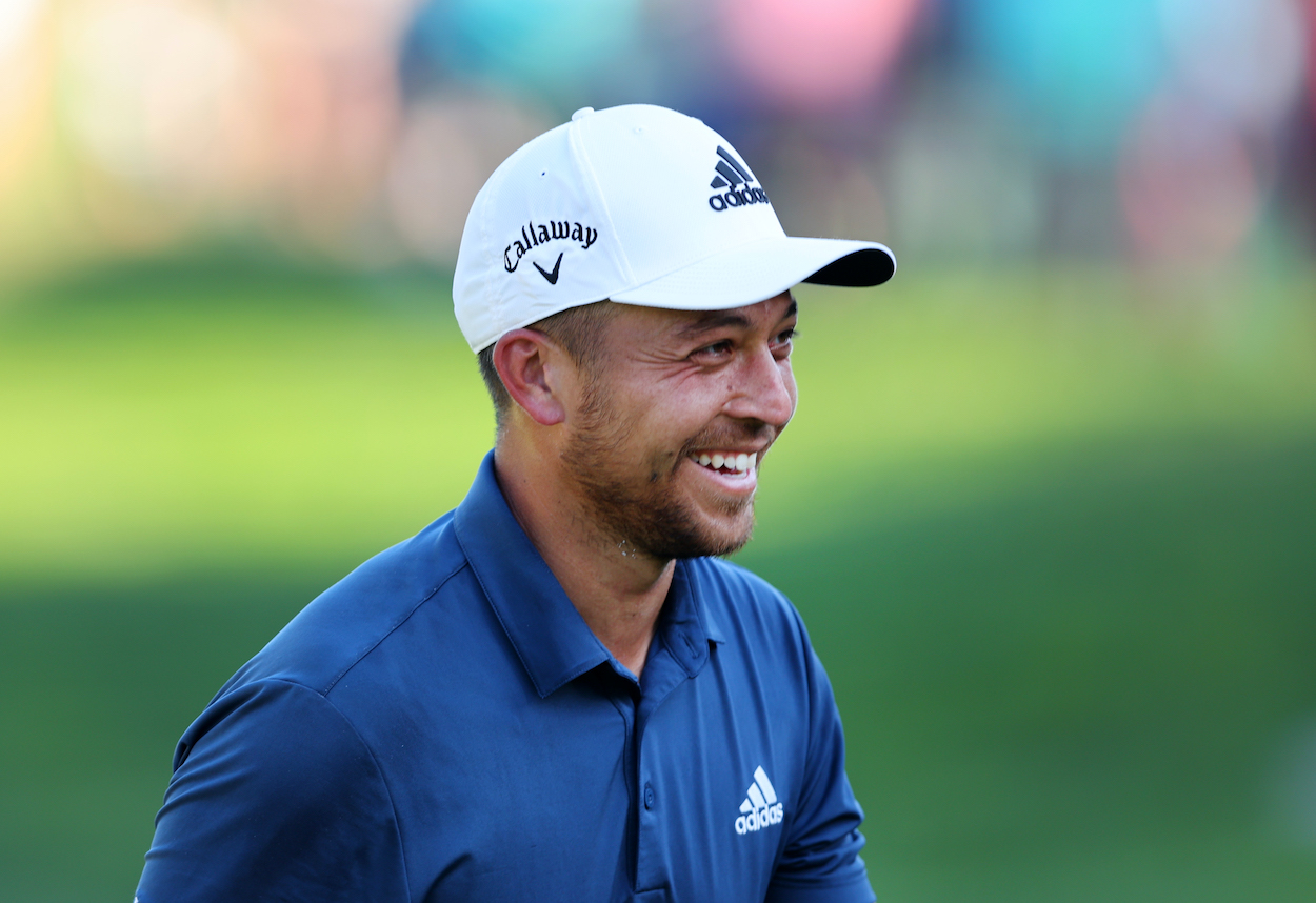 Xander Schauffele laughs during the Travelers Championship.