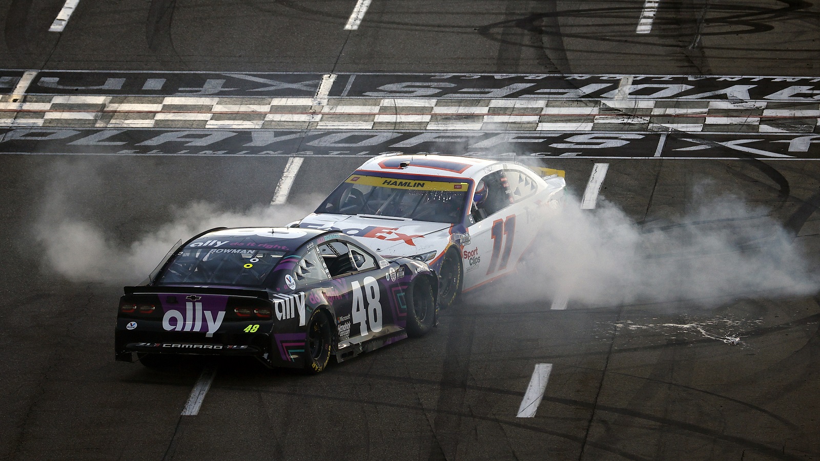 Denny Hamlin impedes Alex Bowman's celebration after winning the NASCAR Cup Series Xfinity 500 at Martinsville Speedway on Oct. 31, 2021.