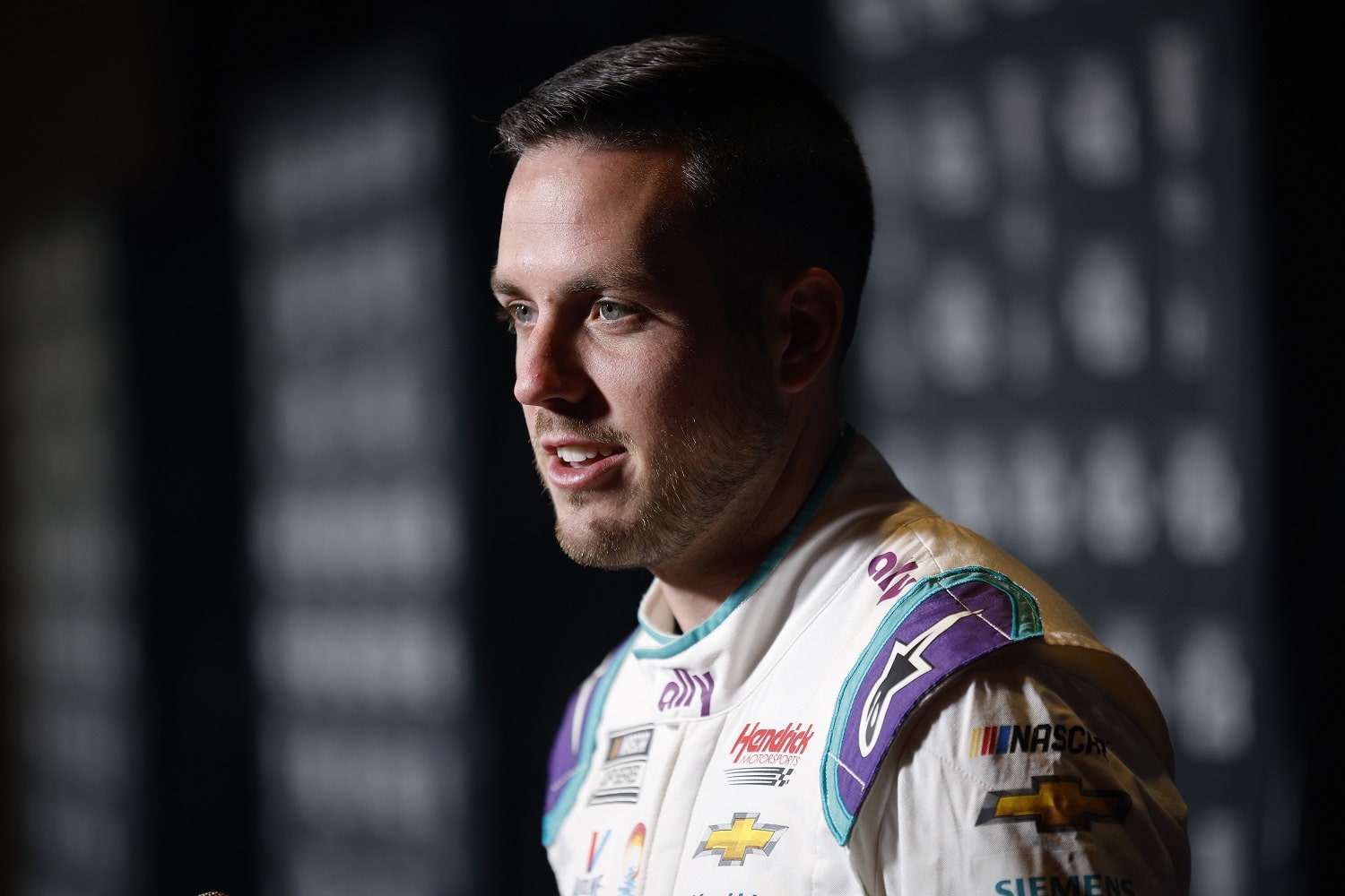 Hendrick Motorsports driver Alex Bowman speaks with reporters during the NASCAR Cup Series Playoff Media Day at Charlotte Convention Center on Sept. 1, 2022 in Charlotte, North Carolina.