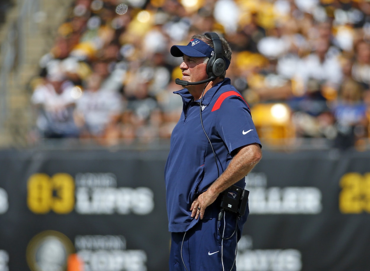 Bill Belichick of the New England Patriots standing on the sideline