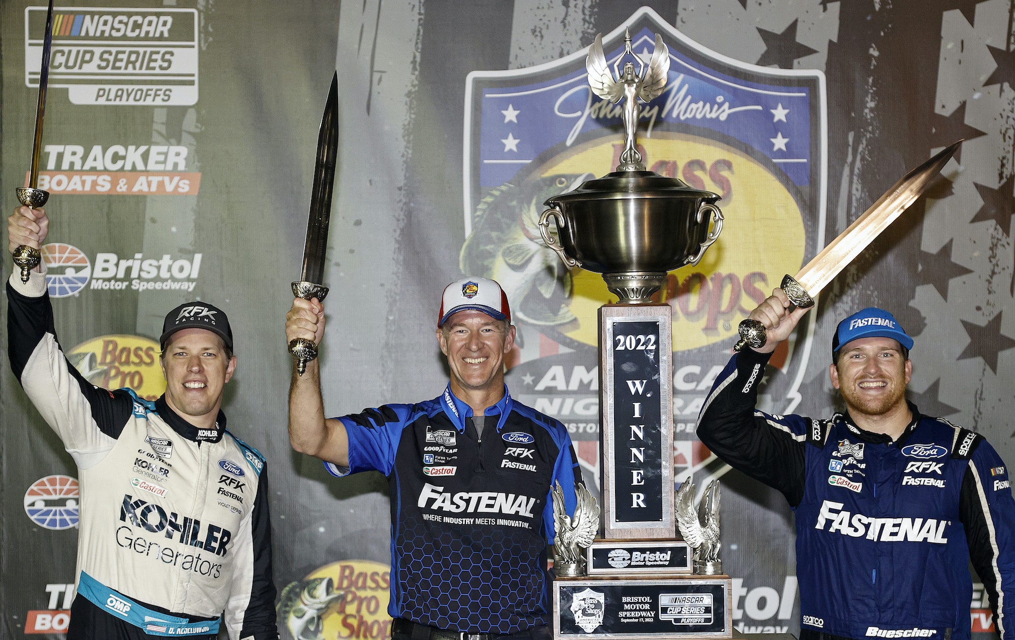 Brad Keselowski, crew chief Scott Graves and Chris Buescher celebrate