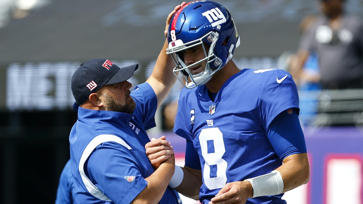 Daniel Jones of the New York Giants speaks with head coach Brian Daboll of the New York Giants.